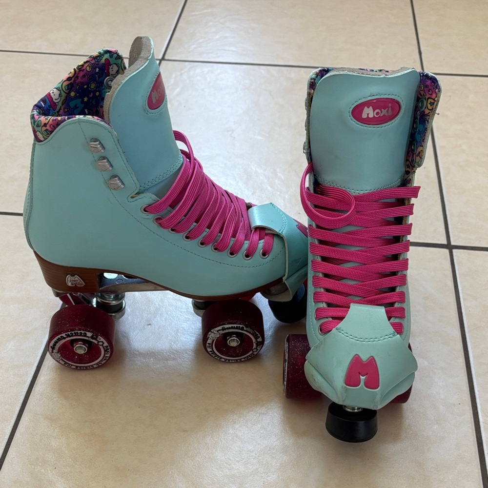 Moxi Light Blue Roller Skates with Pink Accents